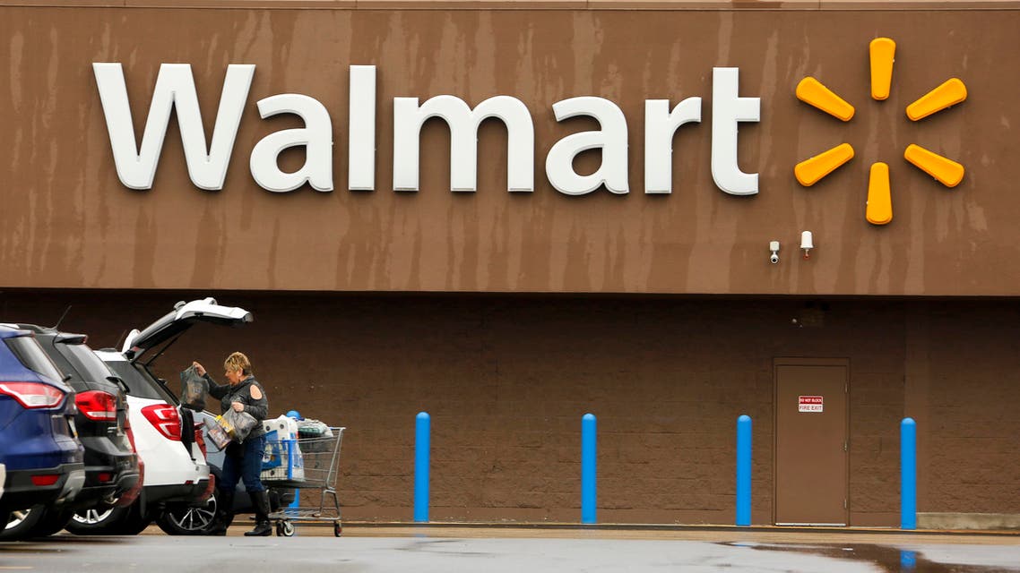 A shopper loads her car after shopping at a Walmart in Pittsburgh. (AP)