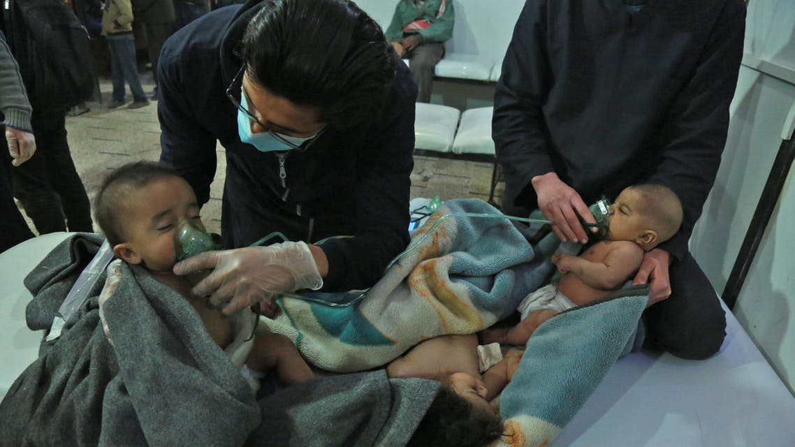 Syrian babies receive treatment for a suspected chemical attack at a makeshift clinic on the rebel-held village of al-Shifuniyah in the Eastern Ghouta region on the outskirts of the capital Damascus late on February 25, 2018. A child died and at least 13 other people suffered breathing difficulties after a suspected chemical attack on the besieged Syrian rebel enclave, a medic and a monitor said. The Britain-based Syrian Observatory for Human Rights said 14 civilians had suffered breathing difficulties after a regime warplane struck the village. HAMZA AL-AJWEH / AFP