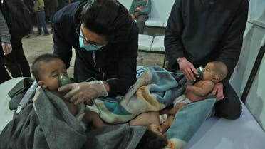 Syrian babies receive treatment for a suspected chemical attack at a makeshift clinic on the rebel-held village of al-Shifuniyah in the Eastern Ghouta region on the outskirts of the capital Damascus late on February 25, 2018. A child died and at least 13 other people suffered breathing difficulties after a suspected chemical attack on the besieged Syrian rebel enclave, a medic and a monitor said. The Britain-based Syrian Observatory for Human Rights said 14 civilians had suffered breathing difficulties after a regime warplane struck the village.   HAMZA AL-AJWEH / AFP