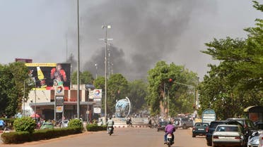 Smoke rises from the site of an armed attack in downtown Ouagadougou, Burkina Faso, on March 2, 2018. (Reuters)