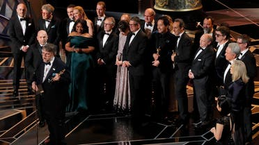 Guillermo del Toro (L) accepts the Oscar for Best Picture for "The Shape of Water." (Reuters)
