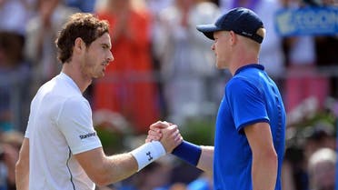 Britain's Andy Murray (L) shakes hands with Britain's Kyle Edmund (R) in their men's singles quarter-final match in the ATP Aegon Championships tennis tournament at the Queen's Club in west London on June 17, 2016. (AFP)