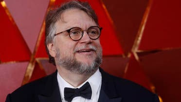 Best Director Nominee Guillermo del Toro wears a Times Up pin. (Reuters)