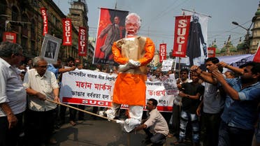 Activists burn Prime Minister Narendra Modi’s effigy against the demolition of Lenin’s statue in Kolkata on March 6, 2018. (Reuters)