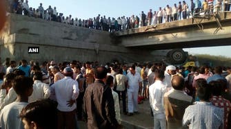Wedding party truck plunges off a bridge in India, killing 25