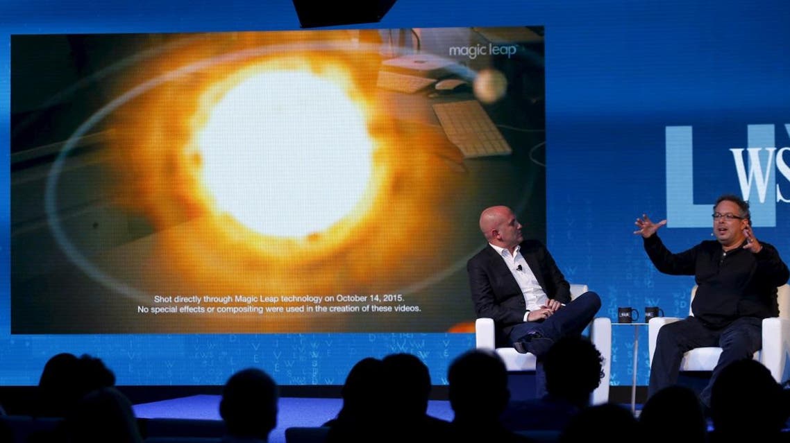 Rony Abovitz, founder president and CEO of Magic Leap (R) unveils a view of his companies augmented reality with Rio Caraeff, chief content officer, at the Wall Street Journal Digital Live ( WSJDLive ) conference. (Reuters)