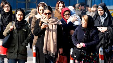 Iranian women wearing hijab walk down a street in Tehran on February 7, 2018. (AFP)