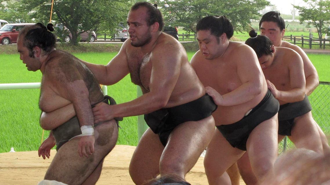 In this file photo, Egyptian sumo wrestler Osunaarashi (second from left), trains with his stablemates in Inazawa, near Nagoya, central Japan. (AP)