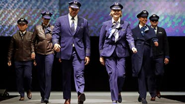 Pilots walk the runway during an unveiling of Alaska Airline’s new employee uniforms on January 18, 2018, in SeaTac, Washington.