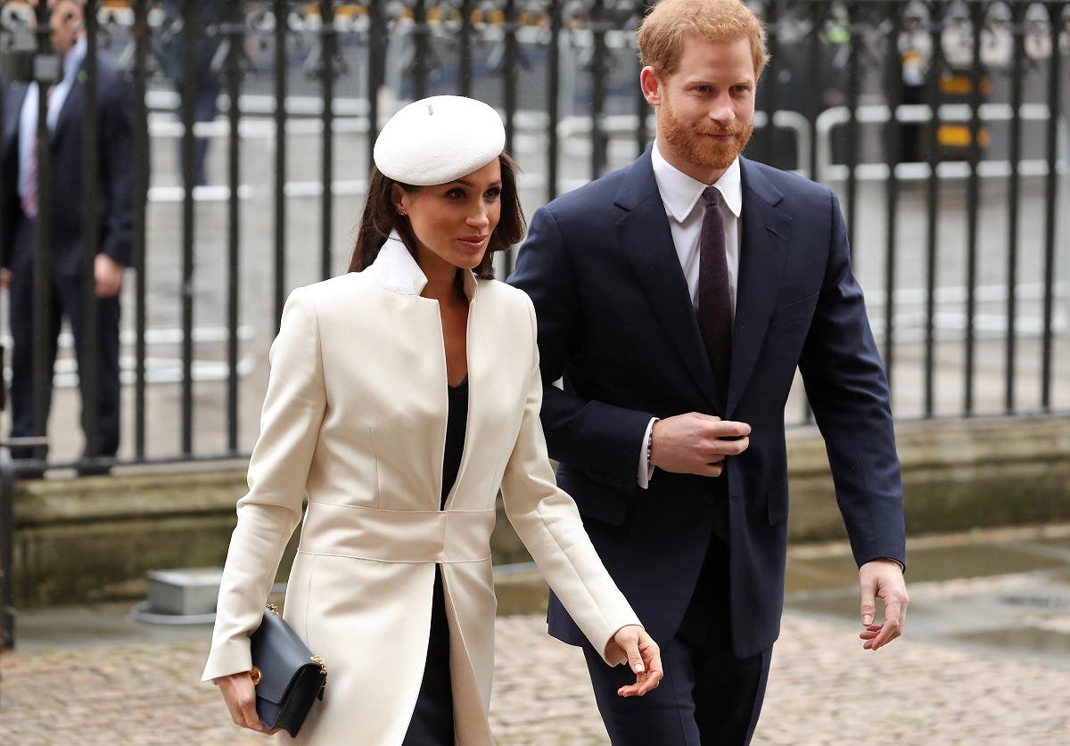 Britain's Prince Harry (R) and his fiancee US actress Meghan Markle attend a Commonwealth Day Service at Westminster Abbey in central London, on March 12, 2018. (AFP)