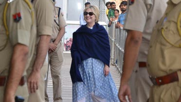 This photo taken on March 15, 2018 shows former US secretary of state Hillary Clinton, with her right hand covered under a shawl, at the airport as she leaves Jodhpur in the western Indian state of Rajasthan. (AFP)