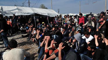 File photo of migrants and refugees blocking railway tracks to protest in the makeshift camp at the Greek-Macedonian border, near the Greek village of Idomeni where thousands of them are stranded. (AFP)