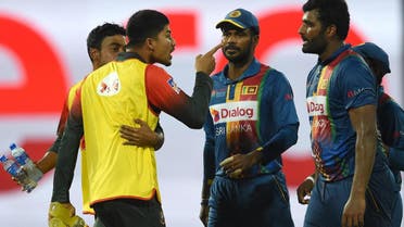 Bangladesh’s Nurul Hasan (2L) exchanges words with Sri Lanka’s skipper Thisara Perera (R) during the sixth Twenty20 (T20) international cricket match between Bangladesh and Sri Lanka of the tri-nation Nidahas Trophy at the R Premadasa stadium in Colombo on March 16, 2018. (AFP)