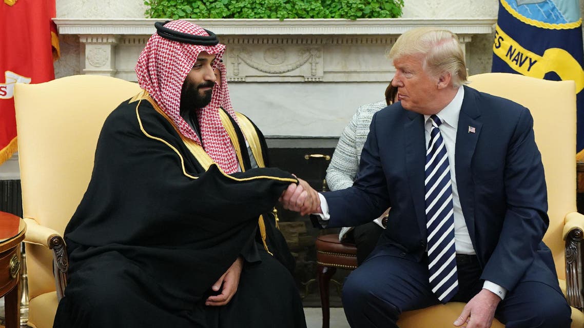US President Donald Trump (R) shakes hands with Saudi Arabia's Crown Prince Mohammed bin Salman in the Oval Office of the White House on March 20, 2018 in Washington, DC. MANDEL NGAN / AFP