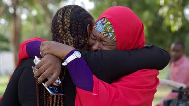 Members of the #BringBackOurGirls (#BBOG) campaign embrace each other at a sit-out in Abuja, Nigeria May 18, 2016. A Nigerian teenager kidnapped by Boko Haram more than two years ago has been rescued, the first of more than 200 girls seized in a raid on their school in Chibok town to return from captivity in the insurgents' forest lair, officials said on Wednesday. REUTERS/Afolabi Sotunde TPX IMAGES OF THE DAY 