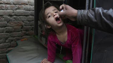 A health worker gives a polio vaccine to a child in Lahore, Pakistan, on Jan. 16, 2018. (AP)