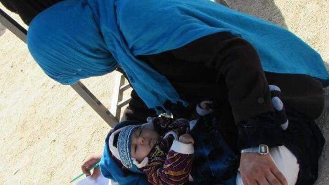 Twenty-two-year-old Jahan Thab was spotted calming down the baby, feeding him and then completing the test. (Twitter)
