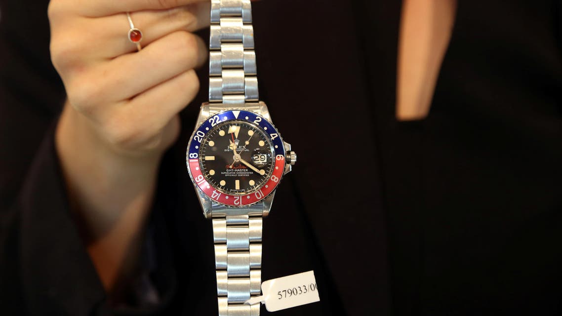 An exhibitor displays the Rolex rare stainless steel dual time automatic wrist watch that was made for Ruler of Dubai Sheikh Mohammed bin Rashid al-Maktoum, at the Christie's auction in Dubai, United Arab Emirates, March 19, 2018. REUTERS/Satish Kumar