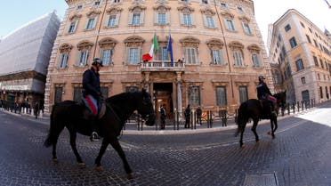 Italian police officers ride horses in front of the Senate prior the opening of the second session day since the March 4 national election in Rome, Italy March 24, 2018. REUTERS/Remo Casilli