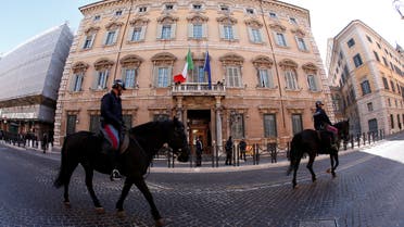 Italian police officers ride horses in front of the Senate prior the opening of the second session day since the March 4 national election in Rome, Italy March 24, 2018. REUTERS/Remo Casilli
