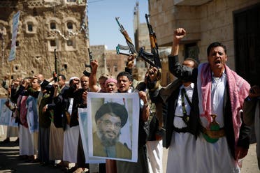 Houthis hold a poster of Hassan Nasrallah to show their support to Hezbollah in Sanaa on March 3, 2016. (AP)
