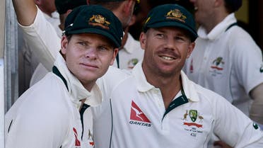 Steve Smith (L) captain of Australia with team mate David Warner (R wait to start the days play during day one of the second cricket Test match between New Zealand and Australia at the Hagley Park in Christchurch on February 20, 2016. (AFP)