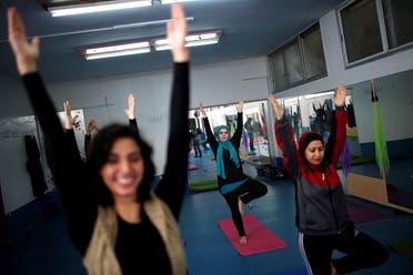 Palestinian women take part in a yoga session in Gaza City March 28, 2018. (Reuters)