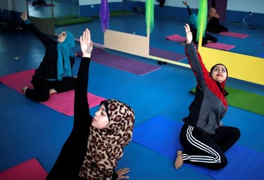 Palestinian women take part in a yoga session in Gaza City March 28, 2018. (Reuters)