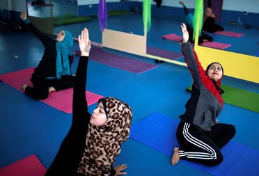 Palestinian women take part in a yoga session in Gaza City March 28, 2018. (Reuters)