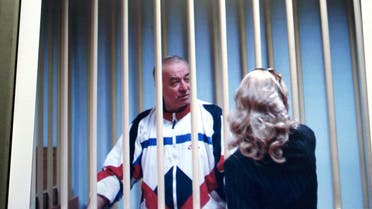 File picture of Sergei Skripal, a former Russian military intelligence officer,  as he speaks to his lawyer from behind bars seen on a screen of a monitor outside a courtroom in Moscow. (AP)