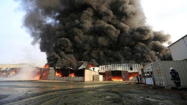 Firefighters try to extinguish a fire engulfing warehouse of the World Food Programme in Hodeida, Yemen. (Reuters)