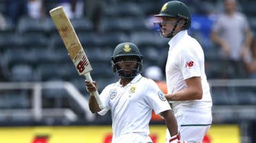 South African batsman Temba Bavuma (left) reacts as he leaves the field with 95 runs not out on the second day of the fourth Test cricket match between South Africa and Australia on March 31, 2018 in Johannesburg. (AFP)