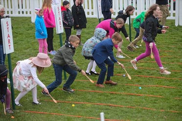 Children participate in the annual White House Easter Egg Roll on the South Lawn of the White House in Washington, Monday, April 2, 2018. (AP