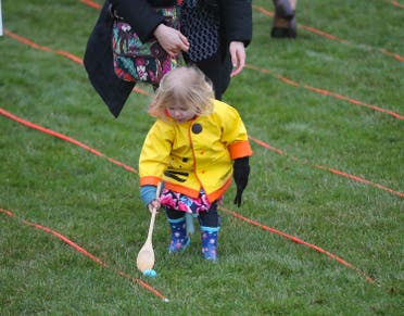 A child participates in the annual White House Easter Egg Roll on the South Lawn of the White House in Washington, Monday, April 2, 2018. (AP