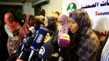 A Sudanese female member of the ISIS speaks to journalists after a group was brought to Khartoum on April 4, 2018 from Libya where they had gone three years ago to join the militant group. (AFP)