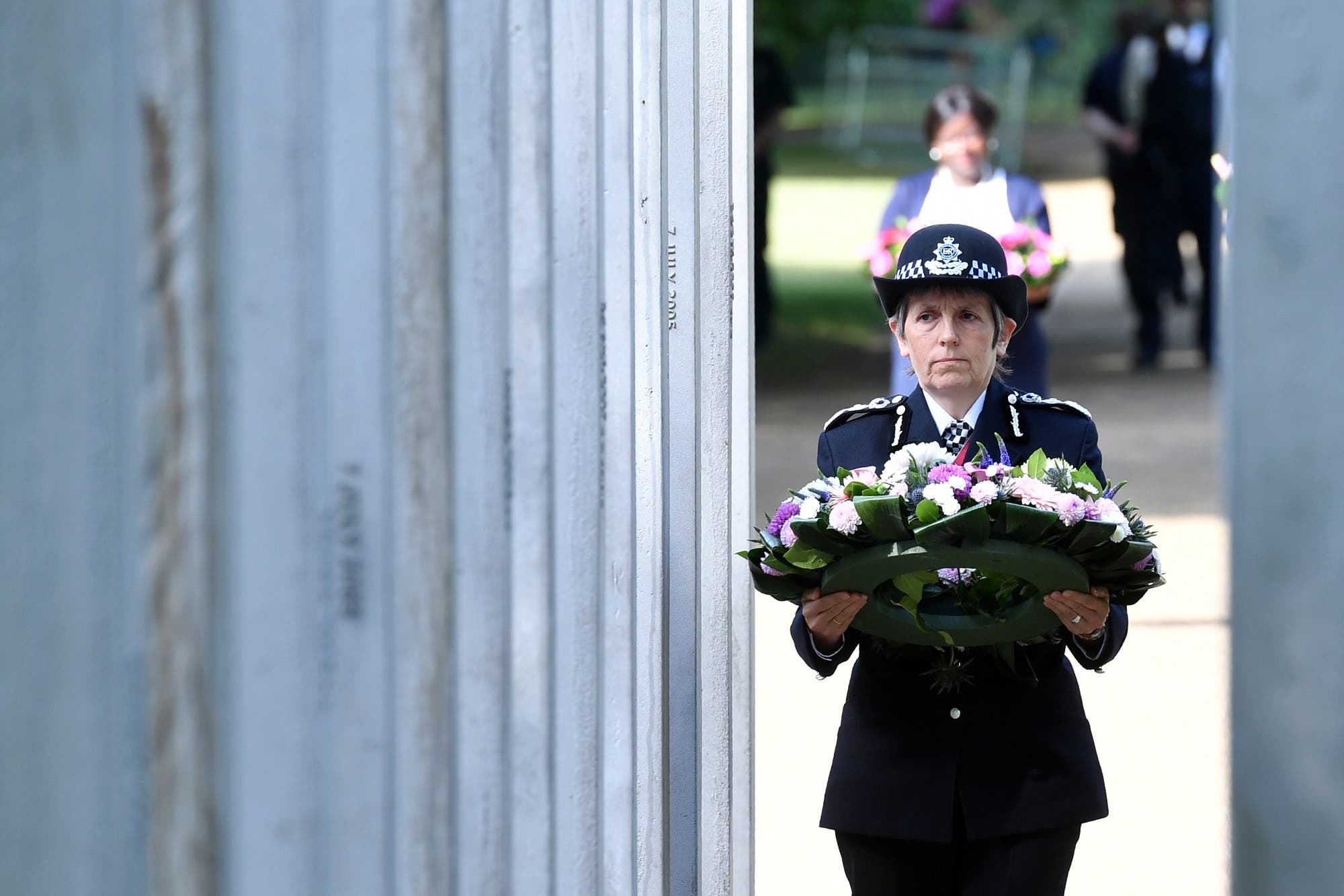 Metropolitan Police Commissioner Cressida Dick lays a wreath at the memorial to those who died in the July 7, 2005 terror attacks in Hyde Park in central London on July 7, 2017. (AFP)