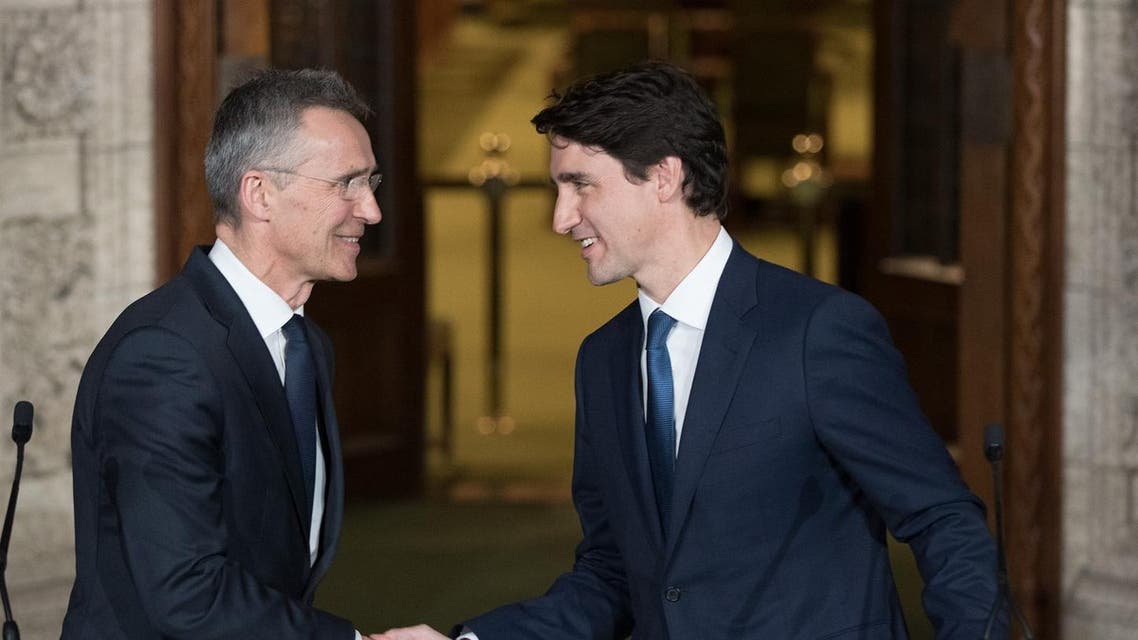 Canadian Prime Minister Justin Trudeau and NATO Secretary General, Jens Stoltenberg shake hands during a joint media availability in Ottawa, Ontario on April 4, 2018. (AFP)