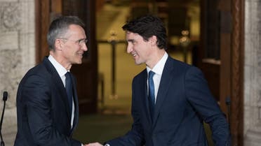 Canadian Prime Minister Justin Trudeau and NATO Secretary General, Jens Stoltenberg shake hands during a joint media availability in Ottawa, Ontario on April 4, 2018.  (AFP)