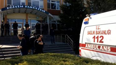Turkish police officers and an ambulance stand at the entrance of Osmangazi University, on April 5, 2018, after a university employee killed four fellow staff members in a shooting, in the western Turkish city of Eskisehir. The attacker was later detained, the Dogan news agency said. Those killed were the deputy dean, faculty secretary and two lecturers at Osmangazi University, the state-run Anadolu news agency added.  DHA / DOGAN NEWS AGENCY / AFP