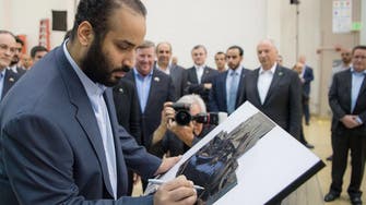 Crown Prince Mohammed bin Salman signs first Saudi satellite at Lockheed Martin