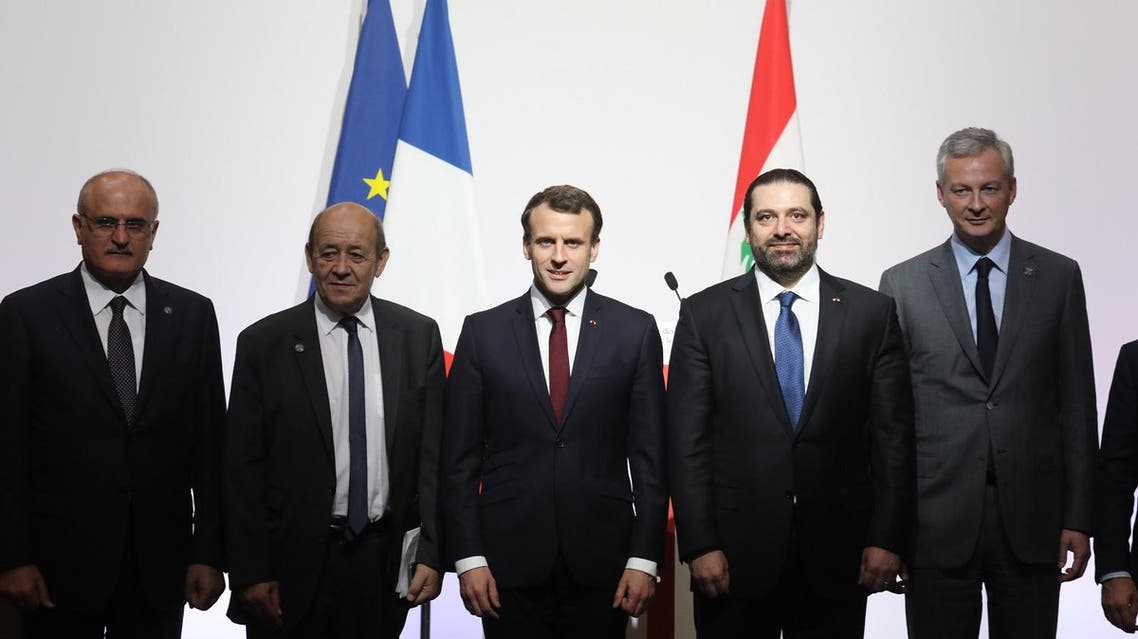 (L-R) Lebanese politician Ali Hassan Khalil, French Foreign Affairs Minister Jean-Yves Le Drian, French President Emmanuel Macron, Lebanese Prime Minister Saad Hariri and French Economy Minister Bruno Le Maire pose during the International CEDRE Conference in Paris. (AFP)