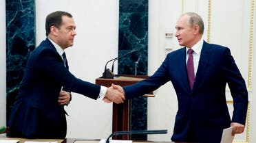 Russian President Vladimir Putin, right, shakes hands with Russian Prime Minister Dmitry Medvedev as he arrives to attend a Security Council meeting in Moscow, Russia, Friday, April 6, 2018. AFP