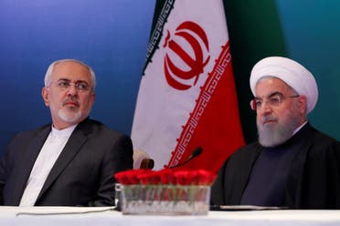 Iranian President Hassan Rouhani (R) and Foreign Minister Mohammad Javad Zarif attend a meeting in Hyderabad, India, on February 15, 2018. (Reuters)