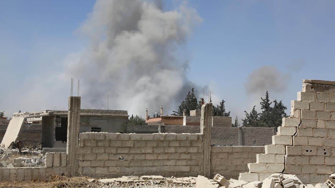 Smoke billows in the town of Douma, the last opposition holdout in Syria's Eastern Ghouta, on April 7, 2018, after Syrian regime troops resumed a military blitz to pressure rebels to withdraw. Backed up by Russia's firepower, Syrian President Bashar al-Assad has ousted his armed opponents from nearly all of Ghouta, their last stronghold on the edge of the capital. The regime has used a combination of a fierce military onslaught and two negotiated withdrawals to empty out 95 percent of the enclave, but rebels are still entrenched in its largest town of Douma. STRINGER / AFP
