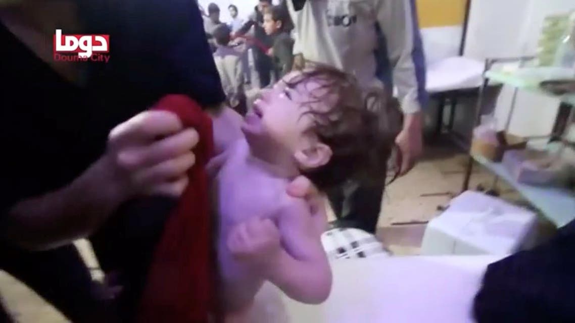A child cries as they have their face wiped following alleged chemical weapons attack, in what is said to be Douma, Syria in this still image from video obtained by Reuters on April 8, 2018. (Reuters)