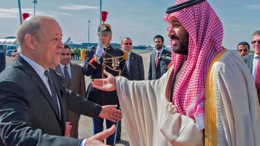 French Foreign Affairs Minister Jean-Yves Le Drian (L) welcomes Saudi Arabia's crown prince Prince Mohammed bin Salman (R) at Paris - Le Bourget airport, north of Paris, on April 8, 2018. (AFP)