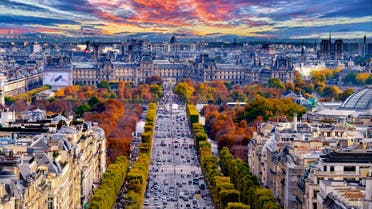 Paris, France - Champs Elysees cityscape. View from Arc de Triomphe. Dramatic sunset sky with clouds in autumn. (Shutterstock)