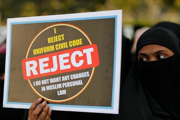 A Muslim woman displays a placard during a protest against “triple talaq” bill in Ahmedabad on January 7, 2018. (Reuters)