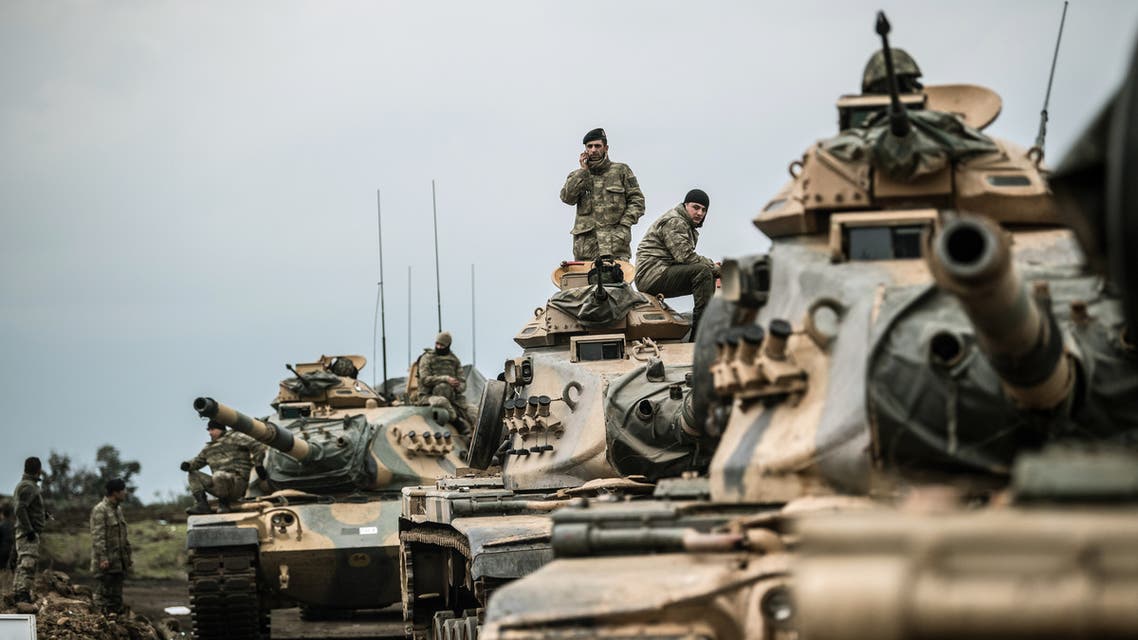 Turkish army tanks gather close to the Syrian border on January 21, 2018 at Hassa, in Hatay province. Turkish forces on January 20, 2018, began a major new operation aimed at ousting the Peoples' Protection Units (YPG) Kurdish militia from Afrin, pounding dozens of targets from the sky in air raids and with artillery. Turkey accuses the YPG of being the Syrian offshoot of the Kurdistan Workers' Party (PKK) which has waged a rebellion in the Turkish southeast for more than three decades and is regarded as a terror group by Ankara and its Western allies. BULENT KILIC / AFP