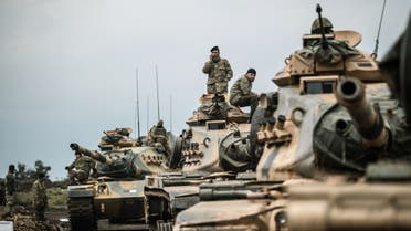 Turkish army tanks gather close to the Syrian border on January 21, 2018 at Hassa, in Hatay province. Turkish forces on January 20, 2018, began a major new operation aimed at ousting the Peoples' Protection Units (YPG) Kurdish militia from Afrin, pounding dozens of targets from the sky in air raids and with artillery. Turkey accuses the YPG of being the Syrian offshoot of the Kurdistan Workers' Party (PKK) which has waged a rebellion in the Turkish southeast for more than three decades and is regarded as a terror group by Ankara and its Western allies.  BULENT KILIC / AFP